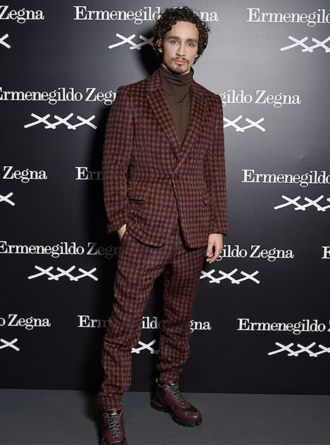 A picture of Robert Sheehan  is a tall, handsome man.